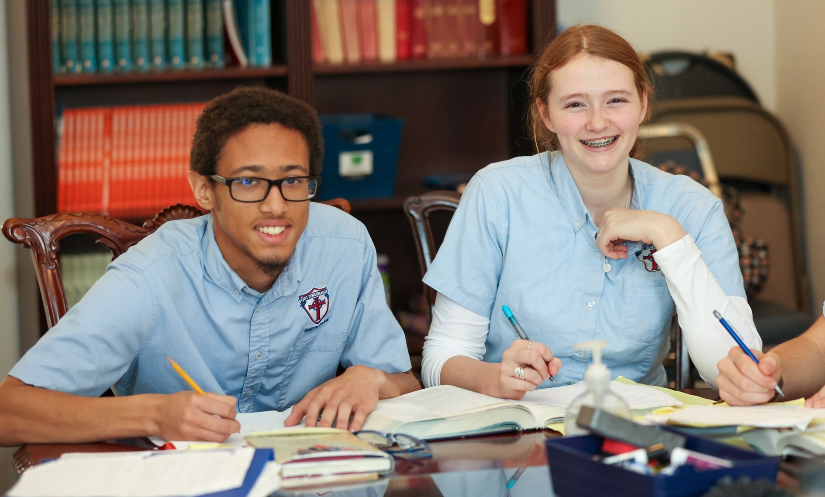 two high schoolers in class